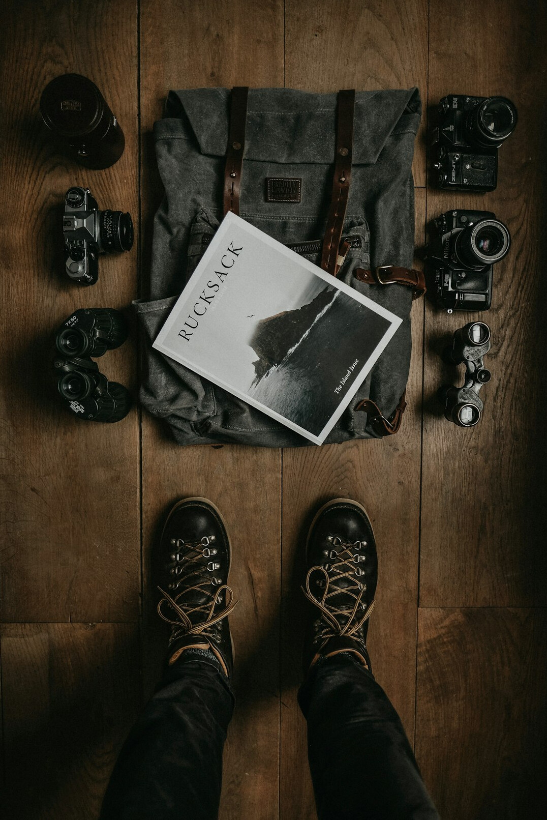 Danish female photographer holding a camera and a printed photo book