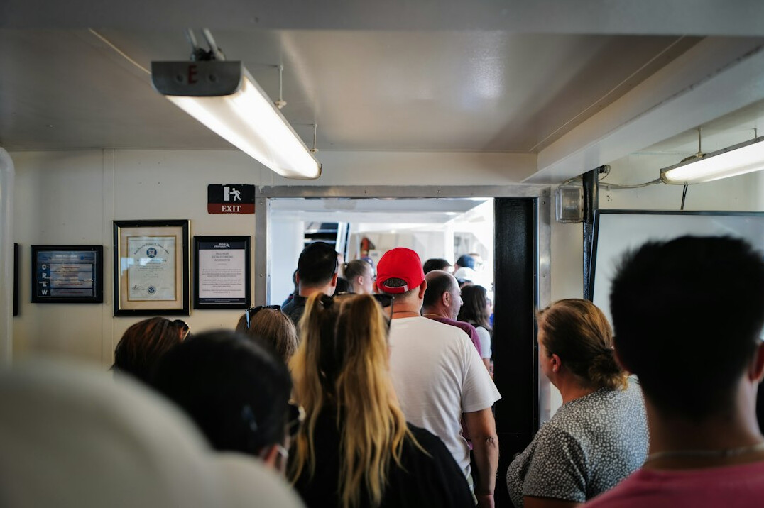 Cars and foot passengers queuing to board a Danish ferry