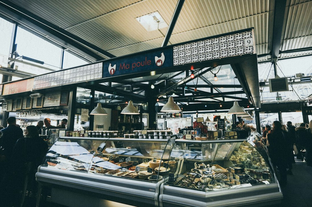 Customers standing in a checkout queue at a Danish supermarket